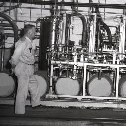 A black and white photo of distilling equipment